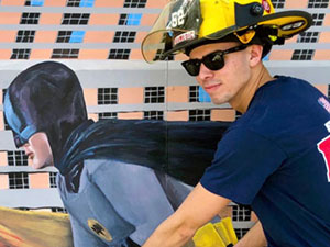 Batman & Robin mural with fireman posing