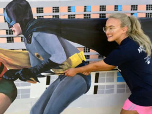 Batman & Robin 3D chalk art mural with girl posing