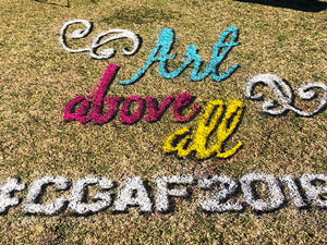 Spray chalk Art Above All 3D on grass