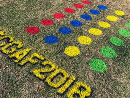 3D chalk art Twister game on grass