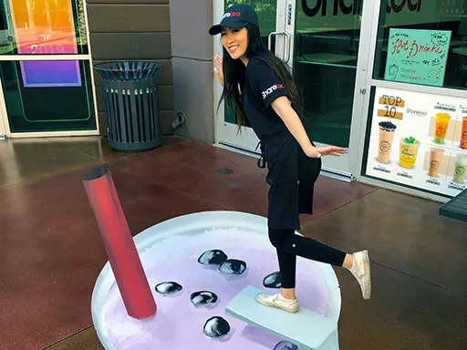 Posing with Sharetea bubble tea diving board 3D chalk art