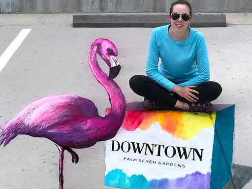 Posing with 3D chalk art flamingo pavement art for Downtown Palm Beach Gardens