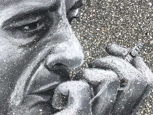 Detail of Johnny Cash portrait pavement chalk art