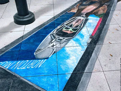 Showing side view skew of 3D chalk art Mona Lisa in a football helmet chalk art