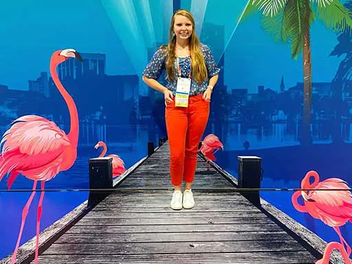 Posing with 3D chalk art dock and flamingos convention center photo backdrop