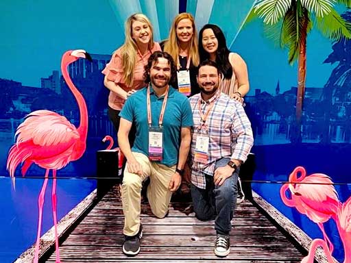 Posing with dock and flamingos convention center photo backdrop