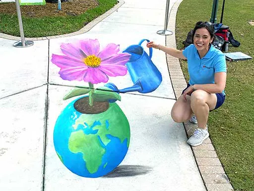 3D chalk art Earth Day plant with interactive watering can