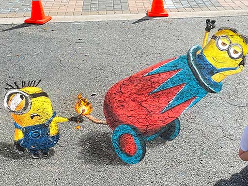 3D chalk art of minions being fired from a cannon