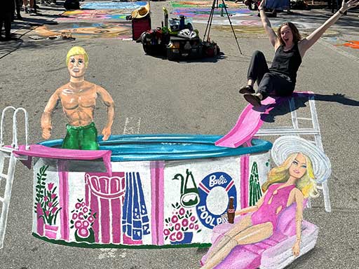 Posing with painted image of Ken and Barbie dolls in Pool Party set
