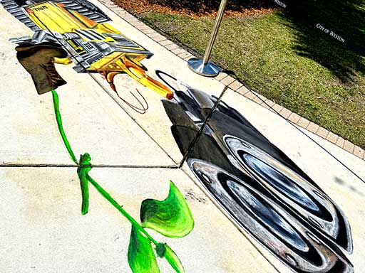 Skewed angle of 3D chalk art of Disney Pixar's Wall-E.