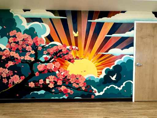 Wall mural featuring cherry blossom tree on a sunrise background.