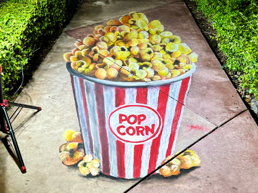 3D chalk art of popcorn bucket.