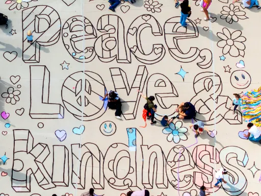 Before shot of large-scale 2D coloring book doodle chalk art for kindness themed event.