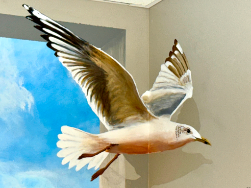 Wall mural of a Florida beach scene with people on the beach and a 3D bird.