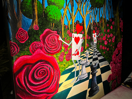 Wall mural based upon Alice and Wonderland painting the roses red.