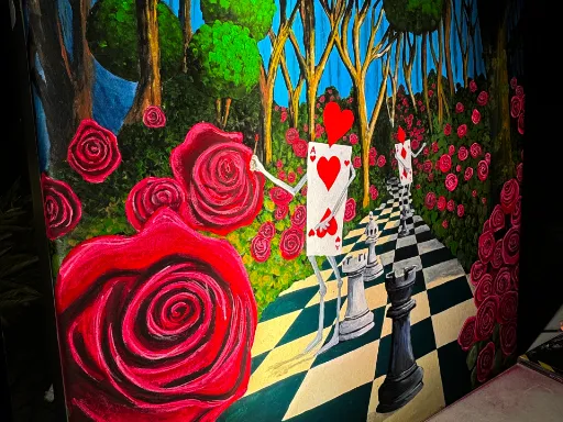 Wall mural based upon Alice and Wonderland painting the roses red.