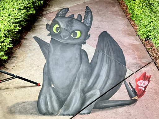 3D chalk art of Toothless dragon from How to Train Your Dragon movie.