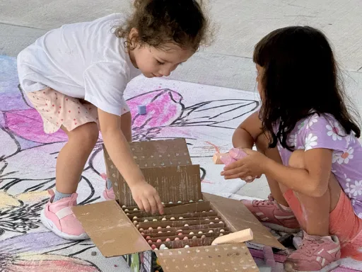 Kids coloring 3D chalk and painted art of coloring book for park grand opening.