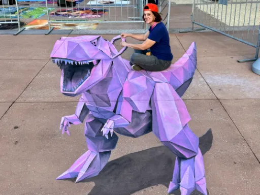 Interactive 3D painted art of pink origami T-Rex dinosaur.