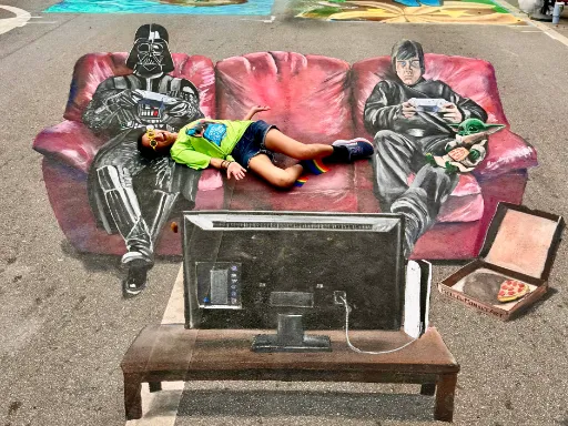 Interactive 3D painted art of Luke Skywalker and Darth Vader playing video games together on a red couch with Grogu.