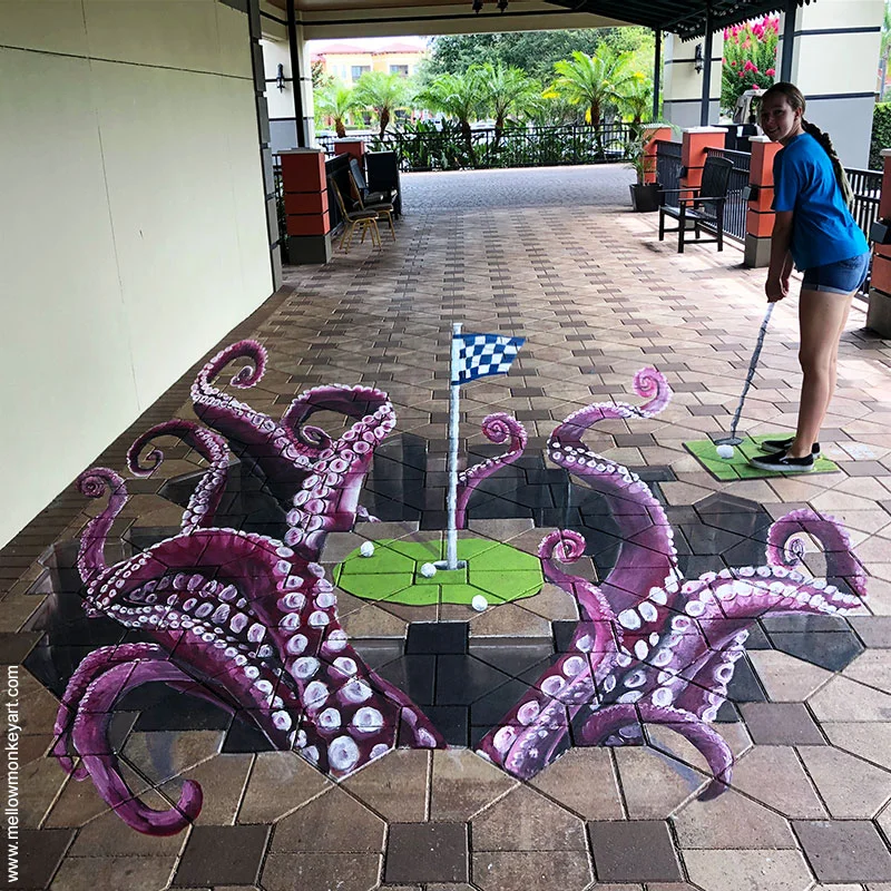 Posing with golf putting green with octopus tentacles 3D chalk art