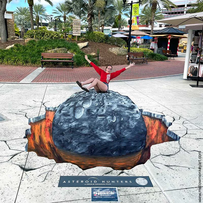 Posing with Asteroid painted art for Kennedy Space Center Visitor's Complex.